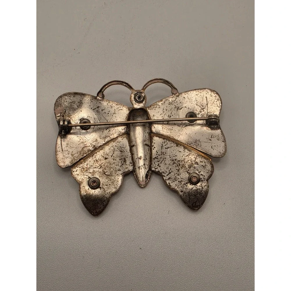 Undefined butterfly brooch